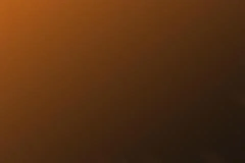 Textured brown gradient background with subtle noise effect for design. Stock Photos