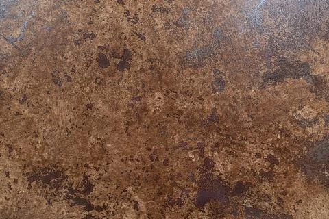 Textured brown stone surface with natural patterns and variations Stock Photos