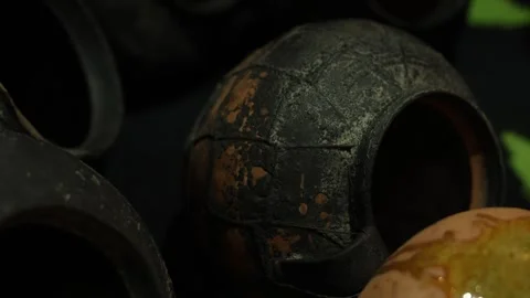 Textured ceramic globe with flaking glaze and warm tones Stock Footage 337938852