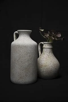 Textured ceramic vases with speckled pattern still life Foto stock