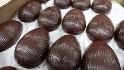 Textured chocolate egg halves in box Stock Footage 334564386