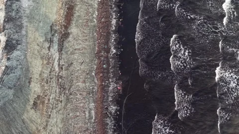 Textured cliff face shows layered rock patterns. Видео 332601065