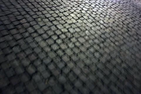 Textured Cobblestone Surface with Depth and Pattern for Background Design Stock Photos
