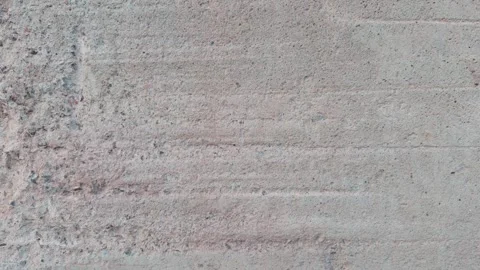 A textured concrete surface with subtle variations in color and pattern bac.. Stock Footage 318399111