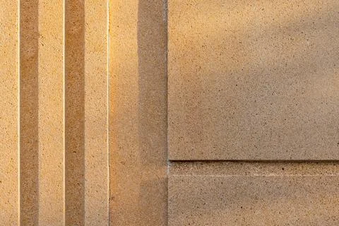 Textured concrete wall surface showcasing a geometric linear pattern 스톡 사진