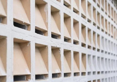 Textured Concrete Wall with Triangular Cutouts 스톡 사진