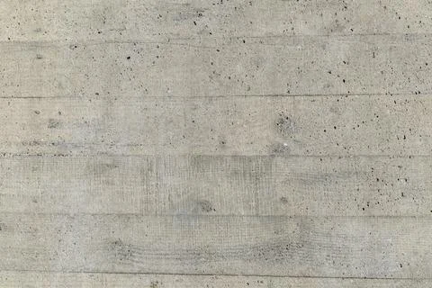 Textured concrete wall with weathered patterns and subtle lines Foto stock