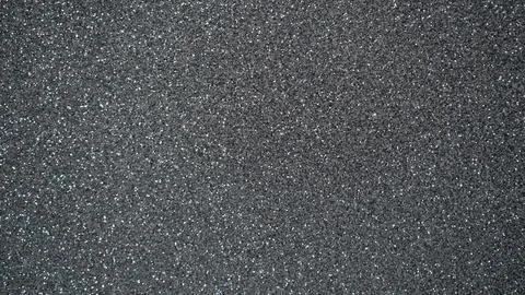 Textured dark gray surface with fine glitter particles, suitable for backgr.. Foto stock