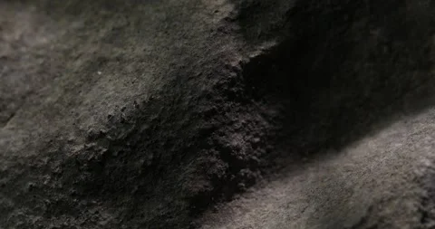 Textured Dark Stone Surface with Deep Shadows Video stock 290767740