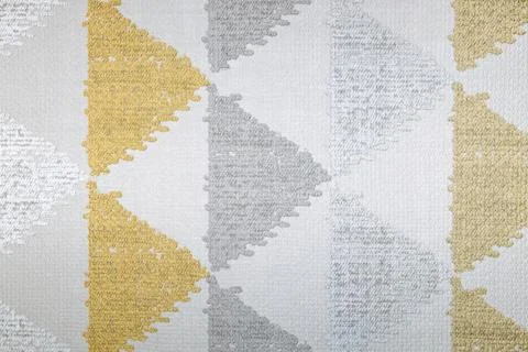 Textured Fabric with Geometric Triangle Pattern in Soft Gray and Mustard Yellow Stock Photos