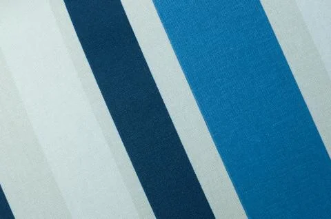 Textured fabric with a pattern of diagonal strips of white and shades of blue Foto stock