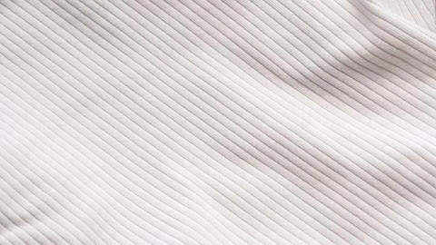 Textured fabric surface with vertical ribbed pattern in soft neutral tones Stock Photos