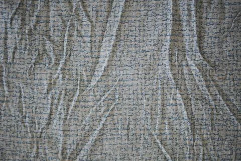 Textured fabric with writing patterns on a flat surface Stock Photos