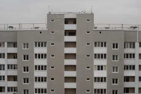 Textured facade of a multi-storey panel house. Stock Photos