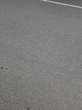 Textured Gray Asphalt Pavement Surface 스톡 사진