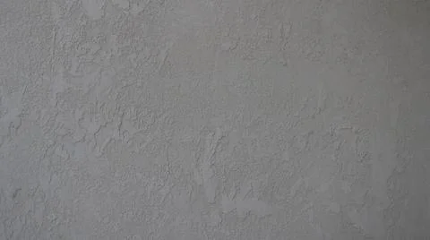 Textured gray background of rough wall plaster Stock Photos