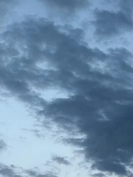 Textured Gray Cloud Layer Against Blue Sky Stock Photos
