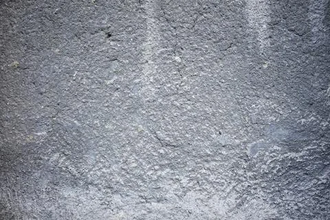 Textured gray concrete wall with subtle patterns and marks 스톡 사진
