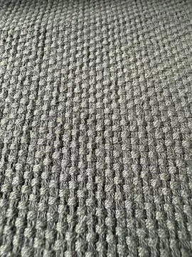 Textured gray fabric surface with a waffle pattern design, suitable for bac.. 写真素材