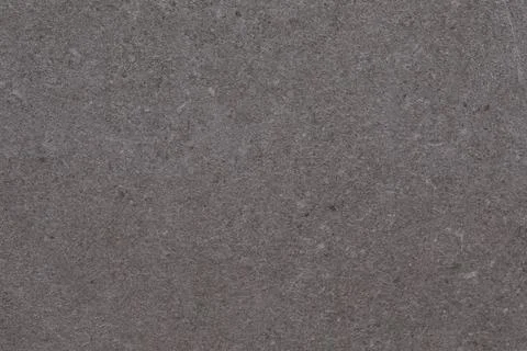 Textured gray surface with subtle variations and natural patterns seen in a Foto stock