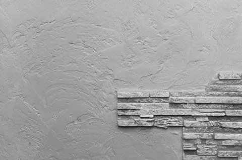 Textured gray wall with stone cladding on one side, Stock Photos