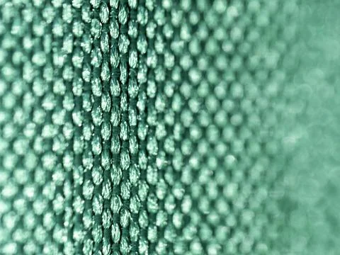 Textured green surface with repeating raised dots Stock Photos