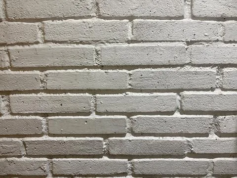 Textured grey brick wall surface background with background, construction Stock-Fotos