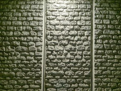 Textured grey stone wall background divided into three vertical sections Stock Photos