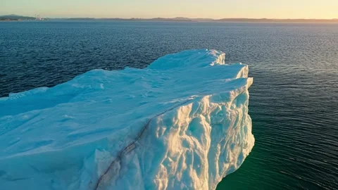 Textured Iceberg Wall Close Up Sunset Light Aerial Newfoundland Video stock 334649006