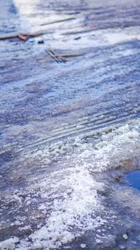 Textured icy surface with patterns and reflections in natural light Stock Photos