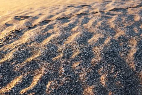 Textured image of beach sand shaped by the wind into wavy shapes Stock Photos