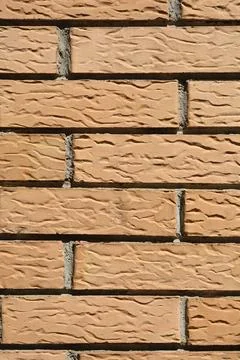 Textured Light Brown Brick Wall Stock-Fotos