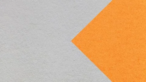Textured light gray paper background with orange arrow, macro. Template with  Illustrazione stock