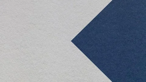 Textured light gray paper background with dark blue arrow, macro. Template .. Stock Photos
