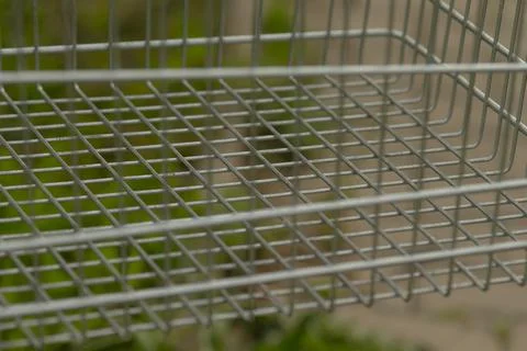 Textured marketware pattern showcases wire basket construction style Stock Photos