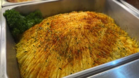 Textured mashed potatoes in buffet tray with golden seasoning Stock Footage 316812829