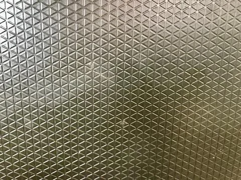 Textured Metal Surface with Diamond Pattern Stock Photos