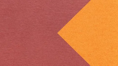 Textured muted red paper background with orange arrow, macro. Template with c Stock Illustration