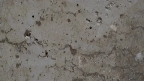 Textured old gray concrete background stained with beige stucco 動画素材 165379705