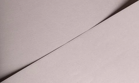 Textured pale canvas background with diagonal shadow lines. Minimal abstract 스톡 사진