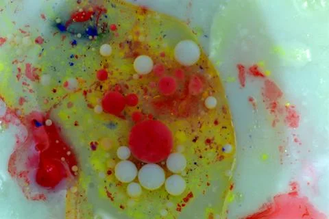 A textured pattern created with multicolored air bubbles on a light background. Stock Photos