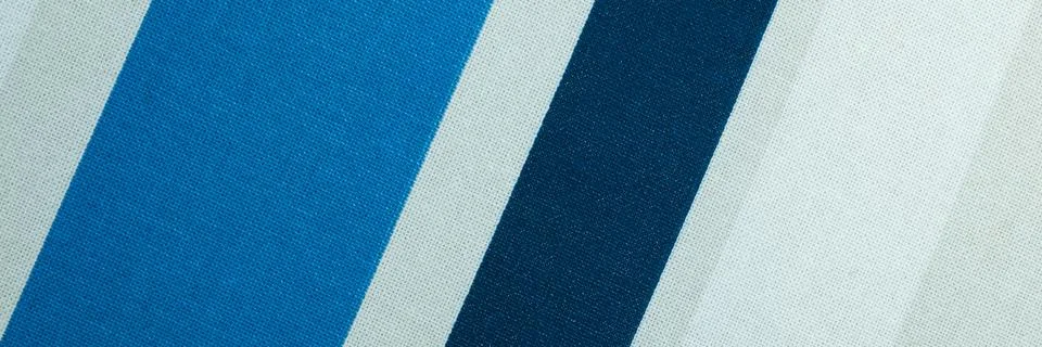 Textured with a pattern of diagonal strips of white and shades of blue Foto stock