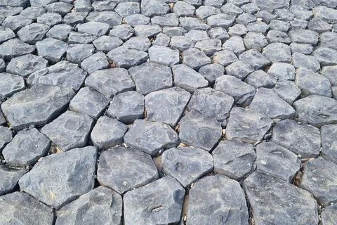 Textured Pattern of Interlocking Gray Stones for Natural Design Background Stock Photos