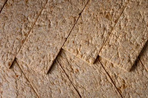 Textured pattern of overlapping whole grain crispbread slices Stock Photos