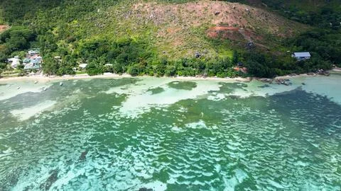 Textured pattern of shallow green and turquoise waters from above. Seychelles Stock Photos