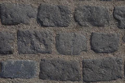 Textured paving brick wall background Stock Photos