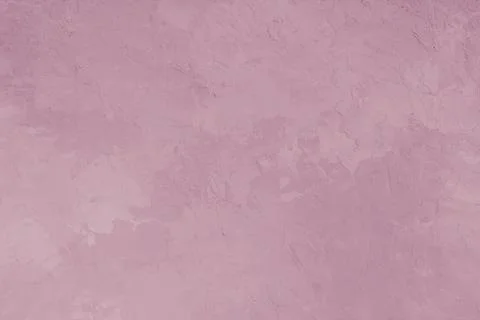Textured pink plaster wall background with rough stucco effect for modern design Foto stock