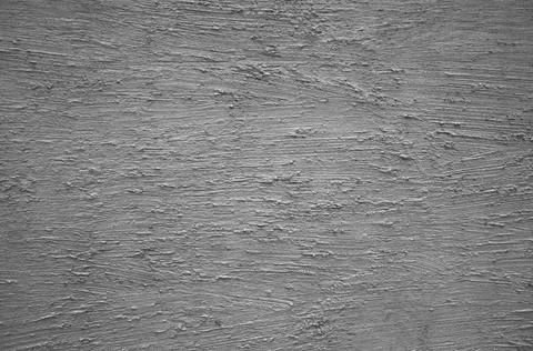Textured plaster made on a gray-colored wall Stock Photos