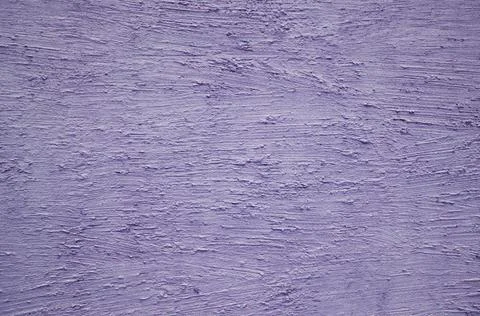 Textured plaster made on a violet-colored wall Stock Photos