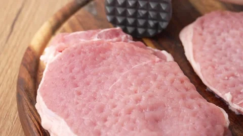 Textured Pork Chops with Tenderizer. Stock Footage 255746290